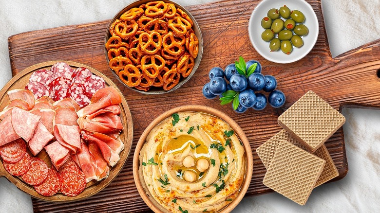 Snacks on wood board.