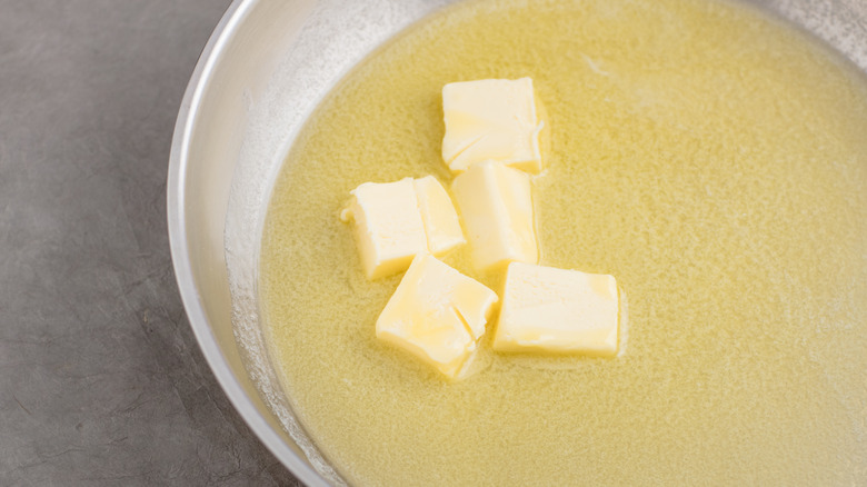 Butter melting in frying pan