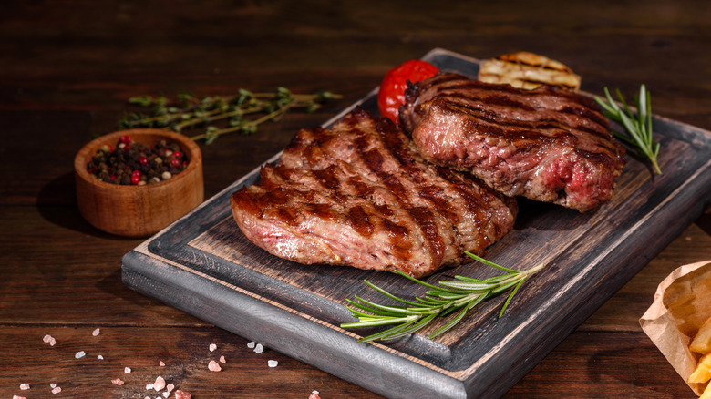 steaks on cutting board