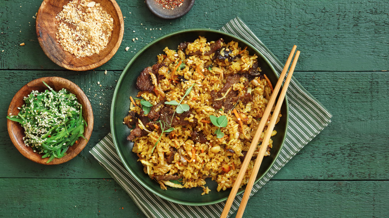 plate beef fried rice with chopsticks