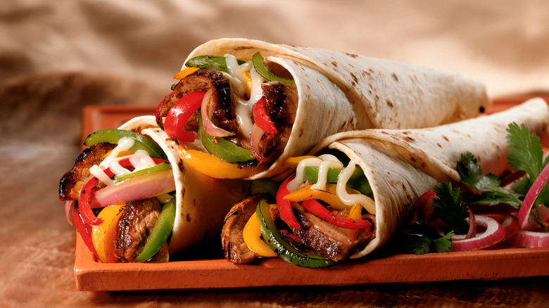 steak wraps with peppers and sauce