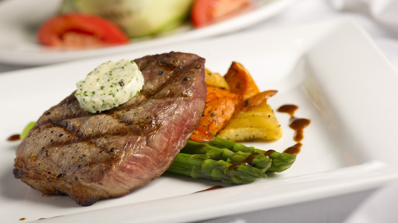 Grilled steak with herb butter