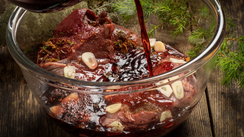 steak marinating with garlic