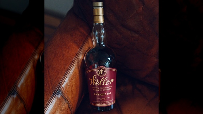 Bottle of Weller Antique 107 in a leather chair