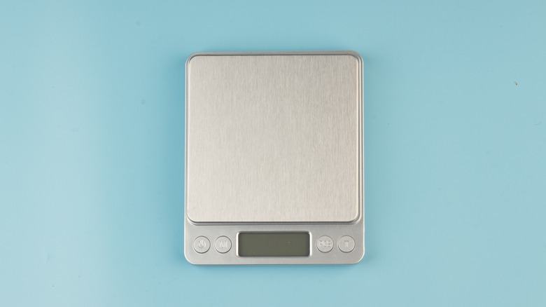 Kitchen scale on blue background