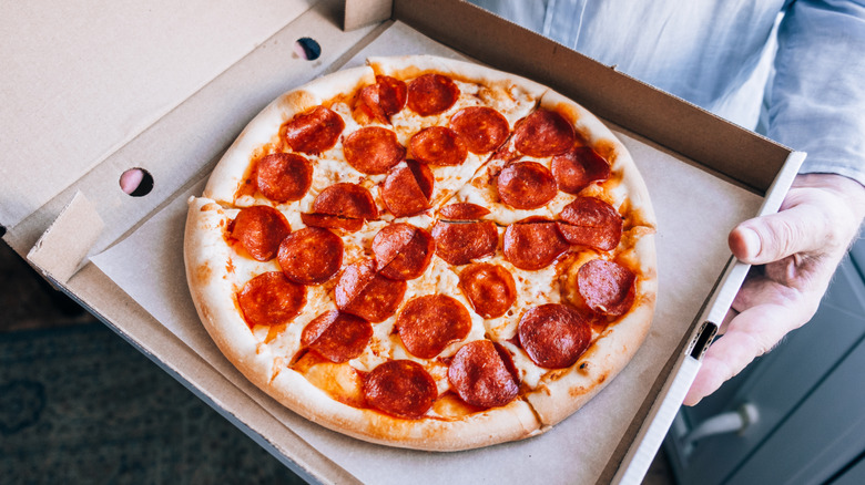 Pepperoni pizza in cardboard box