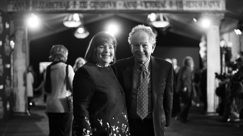 Jeffrey and Ina Garten standing together and smiling in a black and white photo