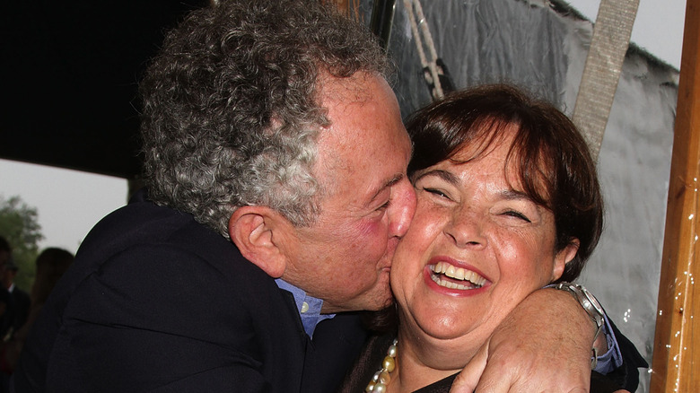 Jeffrey Garten kissing a laughing Ina Garten on the cheek