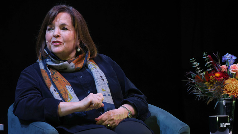 Ina Garten sitting in chair onstage and looking to her right