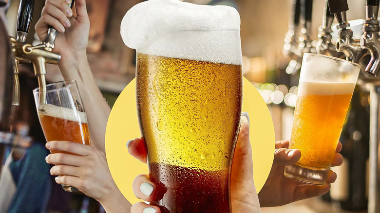 Person holding draft beer glass