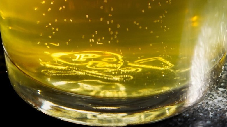 Nucleation logo in beer glass