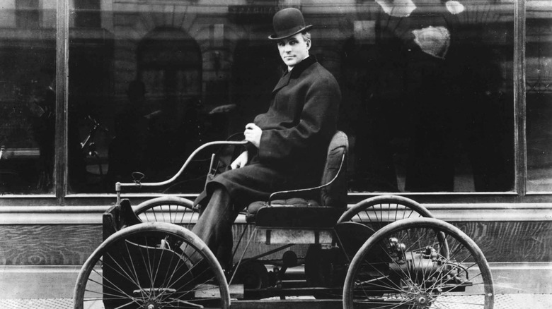 Henry Ford driving early car