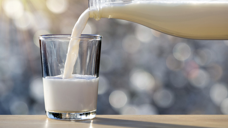 soy milk pouring from bottle