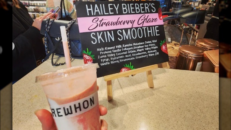 Smoothie and sign on counter