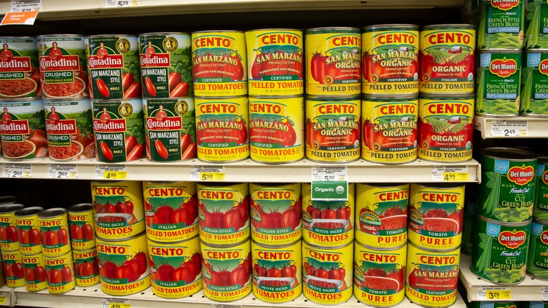 Store shelf of canned tomatoes