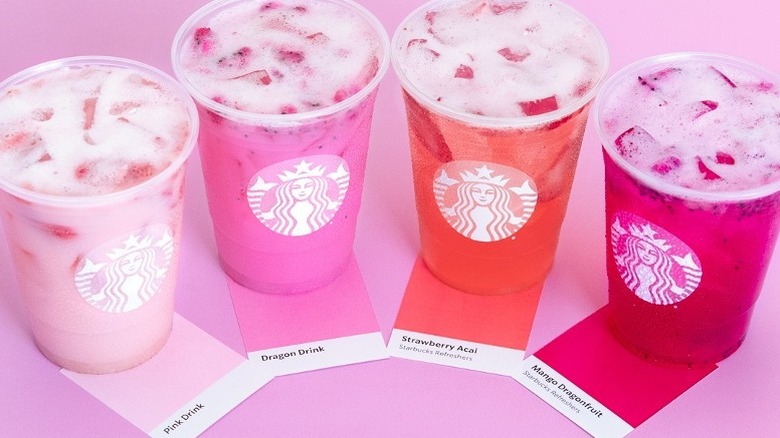 several pink Starbucks drinks