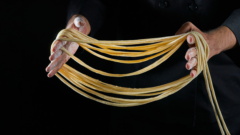 Chef making hand-pulled noodles