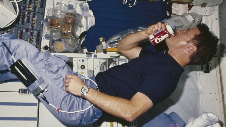 astronaut drinking coke on shuttle