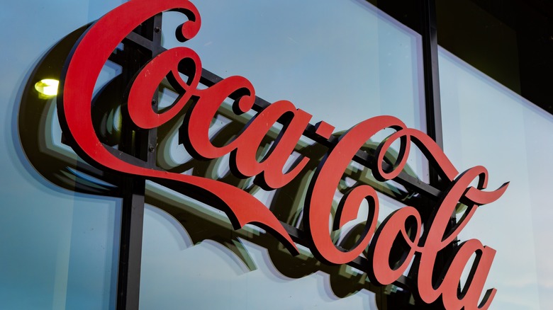 coca cola logo on glass building