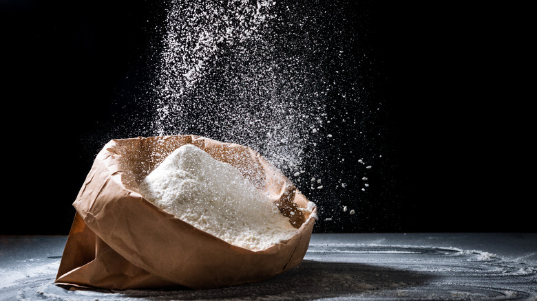 Flour being sifted into bag