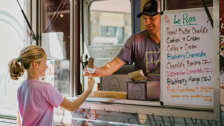 A crowd of people at Main St Food Truck Fest