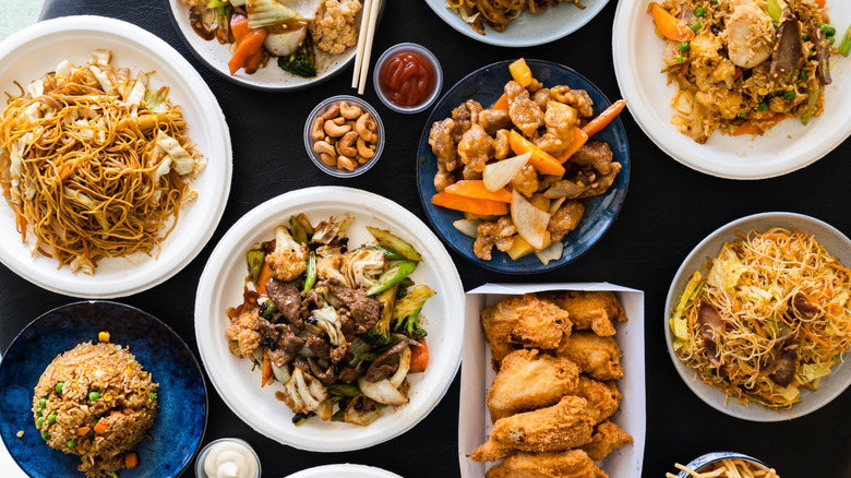 Opened Chinese takeout containers on table