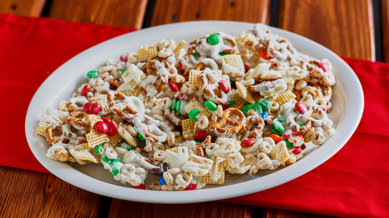 reindeer chow mix with red fabric on wooden table