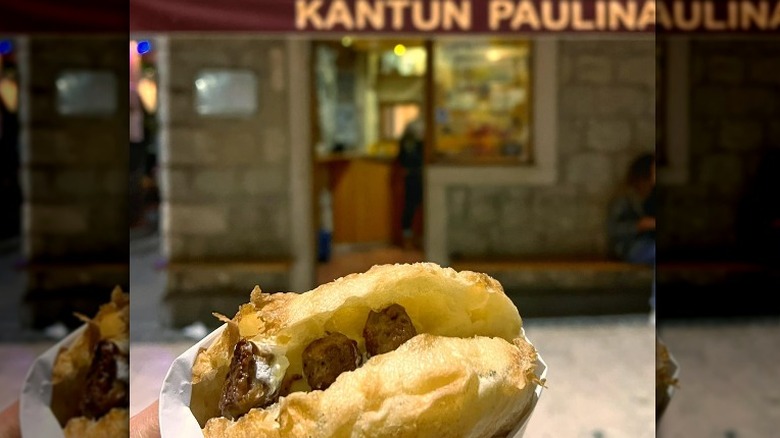 Ćevapi sandwich in front of store