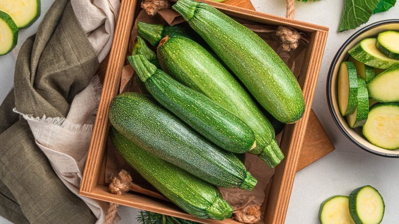 Zucchini in a wooden crate