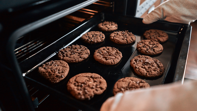 taking cookies out of oven