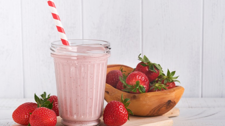 pink smoothie with fresh strawberries