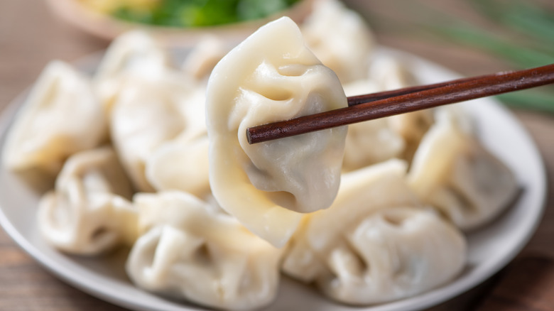 steamed dumplings with chopsticks