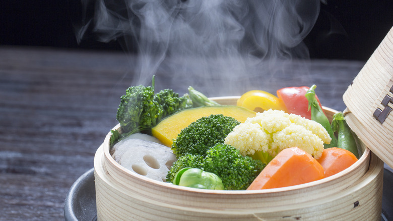 vegetables in bamboo steamer basket