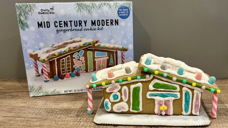 Mid Century Modern Gingerbread House next to the packaging