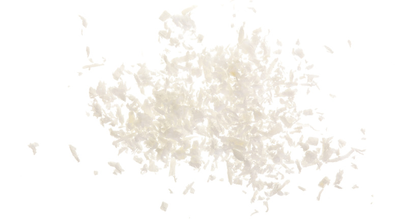 Coconut flakes on white background