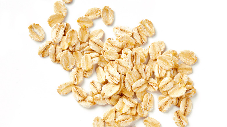 Pile of oats on white background