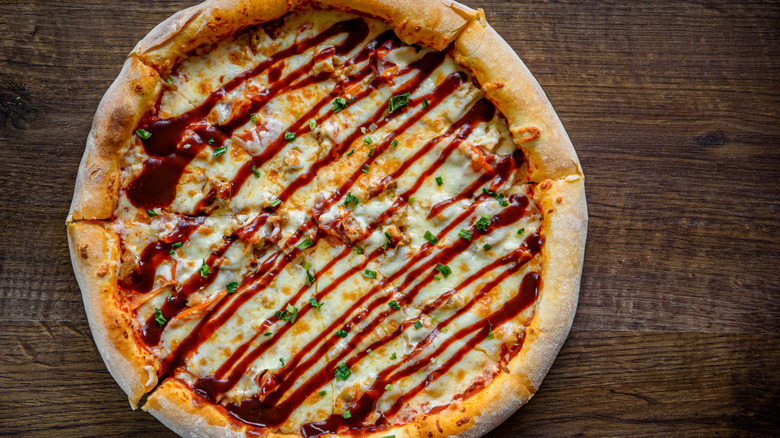 Barbecue pizza drizzled with sauce