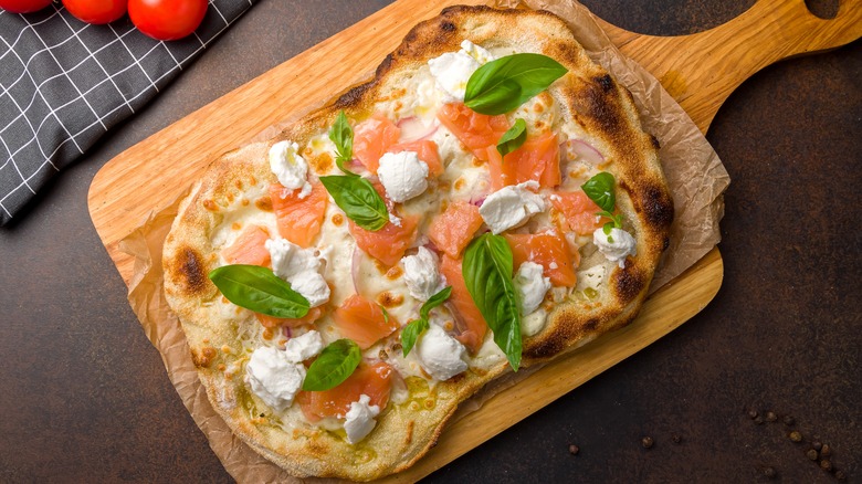 Smoked salmon pizza with basil