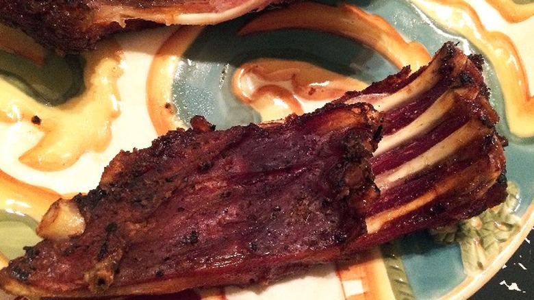 grilled alligator ribs on plate