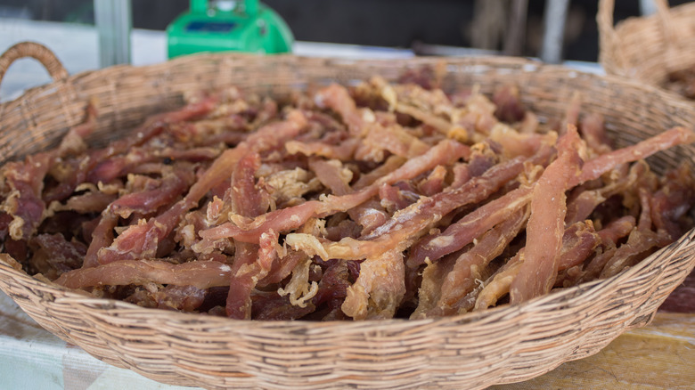 basket of dried alligator meat