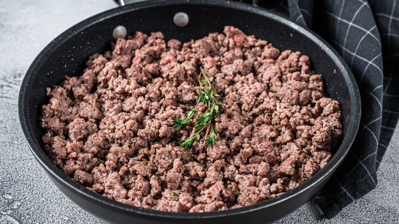 Cooked ground beef in pan