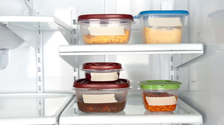 Labeled food containers in refrigerator