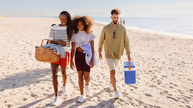 leaving the beach with coolers