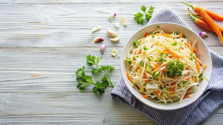 coleslaw in white bowl, cilantro 