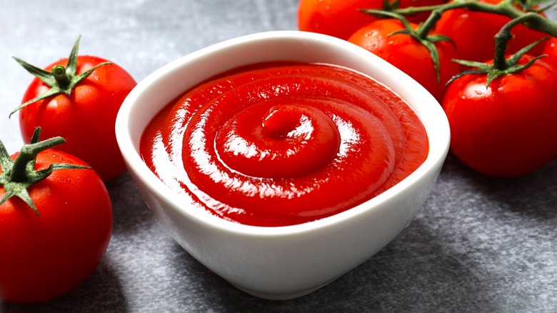 Red ketchup in white dish