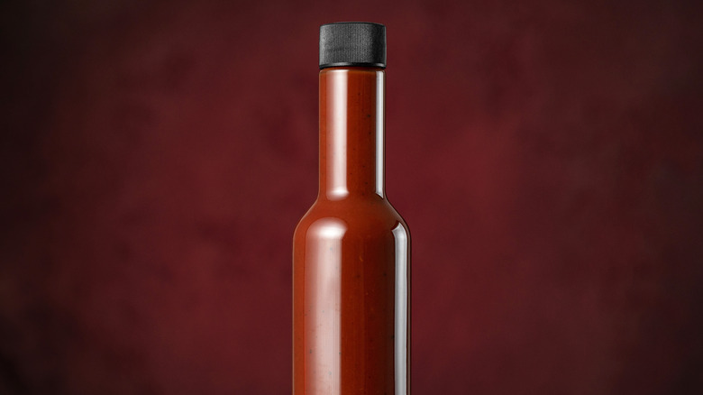 bottle of hot sauce with no label