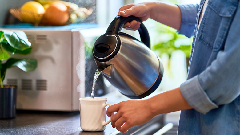 Pouring boiling water into cup