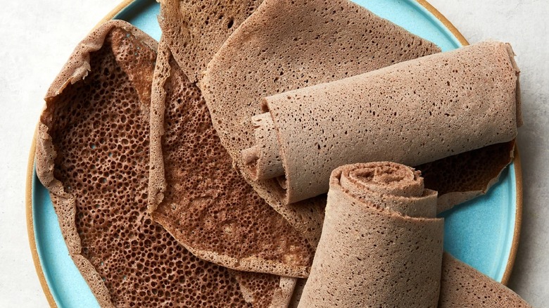 Injera on blue plate