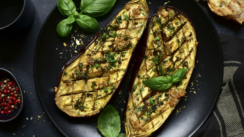 eggplant with garnish black plate