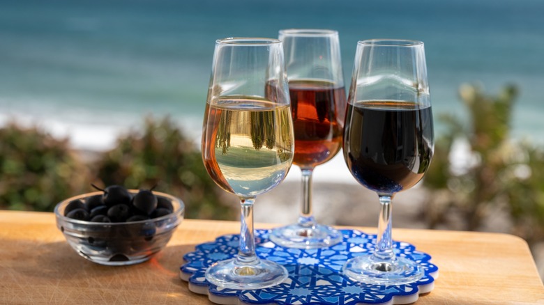 Three glasses sherry ocean scene